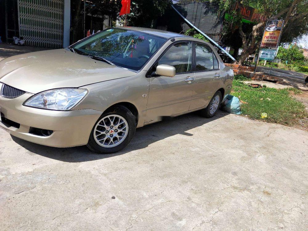 Mitsubishi Lancer 2004 - Bán Mitsubishi Lancer đời 2004, màu vàng, xe nhập xe gia đình