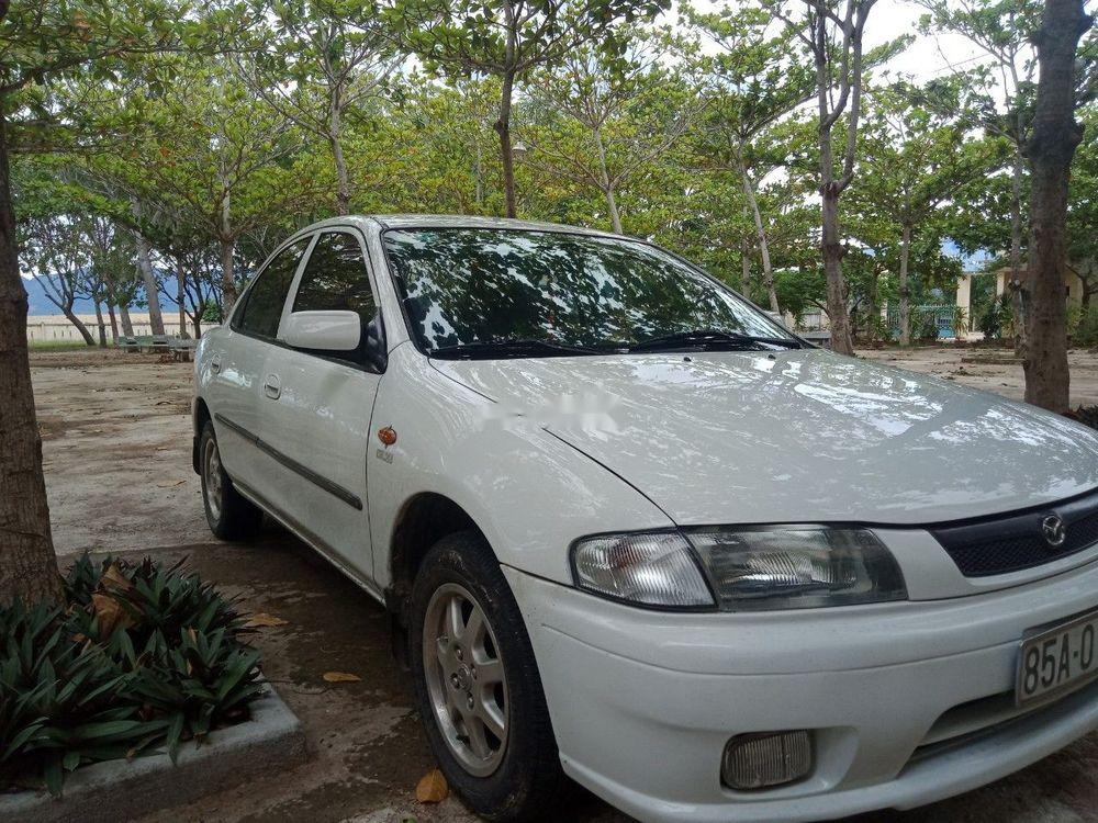 Mazda 323 1.6 2000 - Gia đình bán Mazda 323 1.6 đời 2000, màu trắng, xe nhập