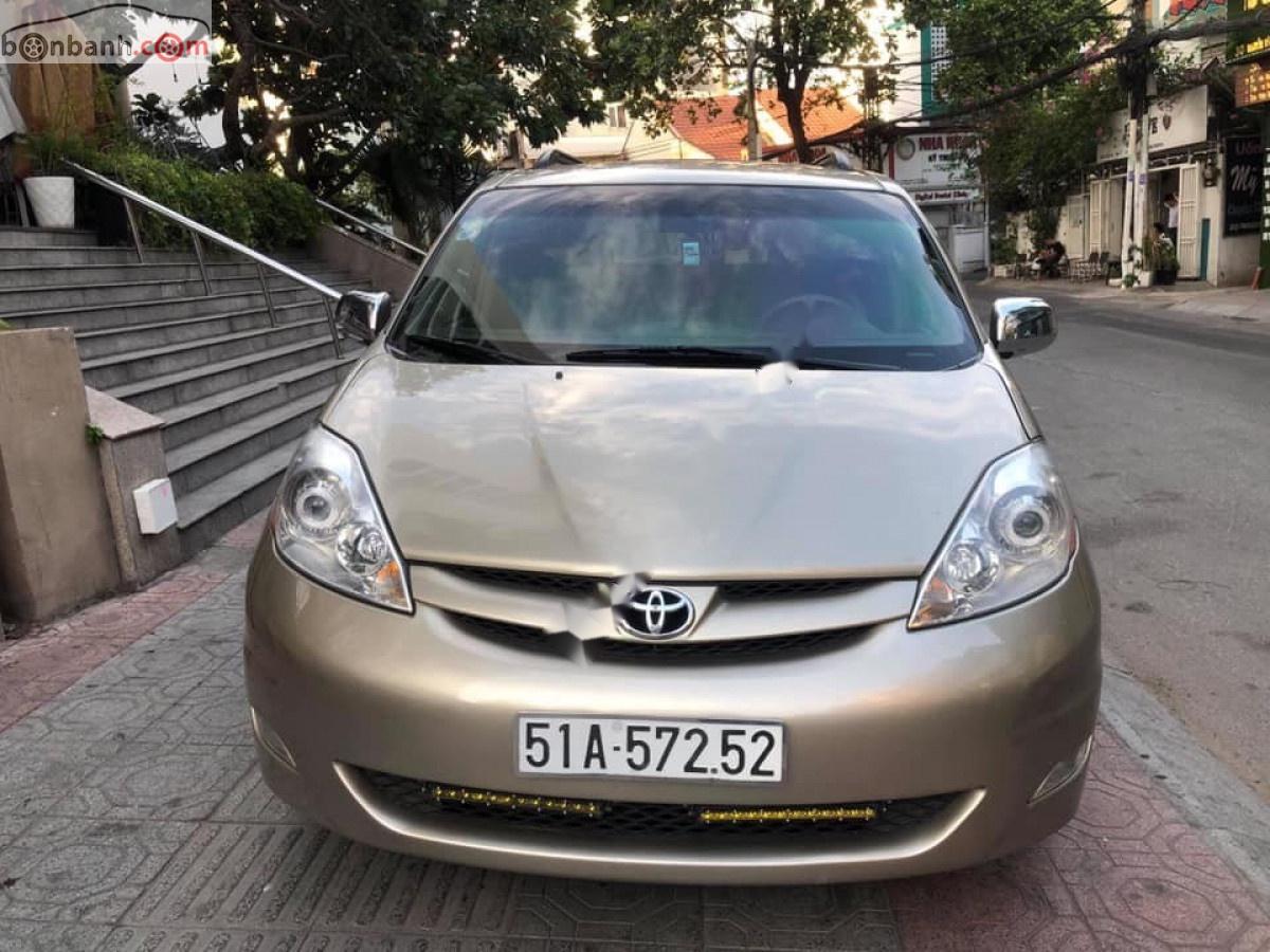 Toyota Sienna 2008 - Gia đình bán xe Toyota Sienna sản xuất 2008, màu vàng, xe nhập