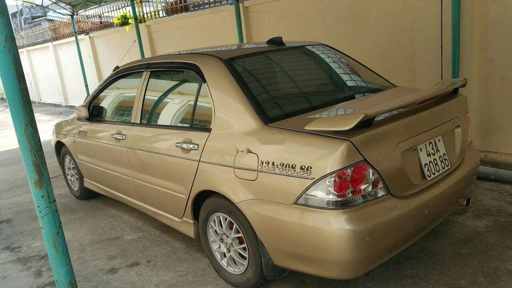 Mitsubishi Lancer 2004 - Cần bán lại xe Mitsubishi Lancer đời 2004, màu vàng xe gia đình, giá chỉ 230 triệu