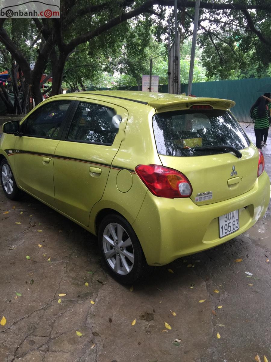 Mitsubishi Mirage 1.2 AT 2014 - Cần bán lại xe Mitsubishi Mirage 1.2 AT đời 2014, màu vàng, xe nhập còn mới