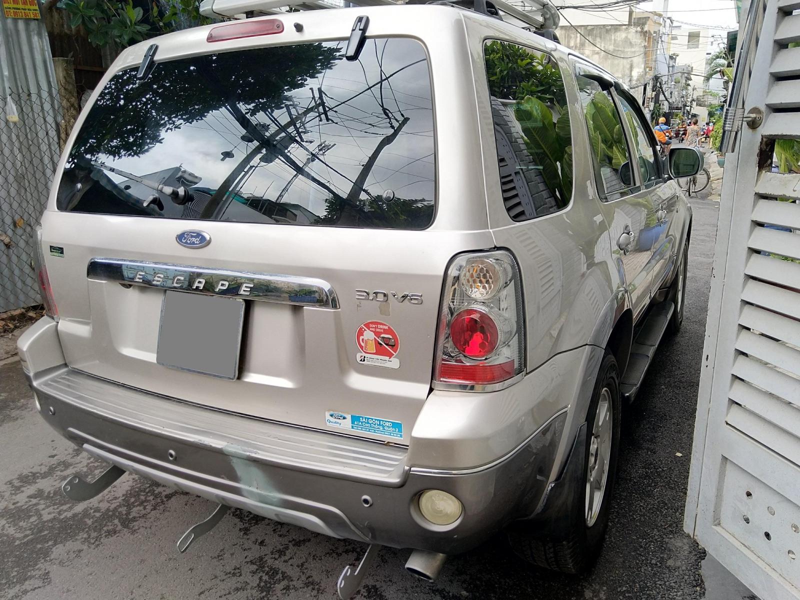 Ford Escape 2007 - Cần bán con Escape 2007, màu bạc, số tự động