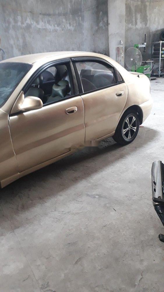 Daewoo Lanos   2001 - Cần bán Daewoo Lanos sản xuất năm 2001, màu vàng