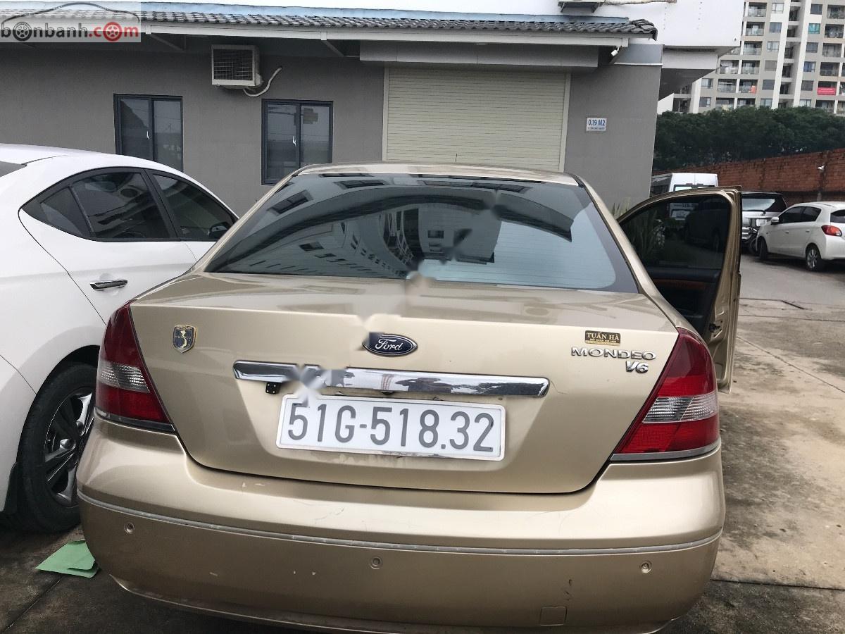 Ford Mondeo 2004 - Bán Ford Mondeo sản xuất 2004, màu vàng, chính chủ