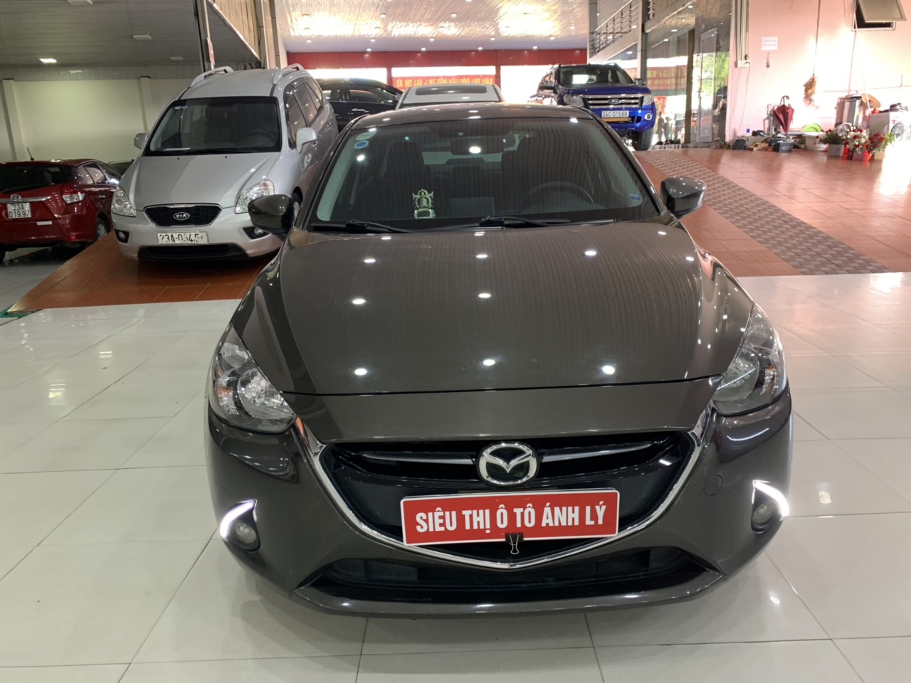 Mazda 2 2016 - Bán xe Mazda 2 1.5AT đời 2016, màu kem (be), 475tr