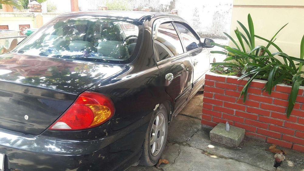 Kia Spectra 2003 - Nâng đời cần bán xe Kia Spectra 2003, màu đen, nhập khẩu