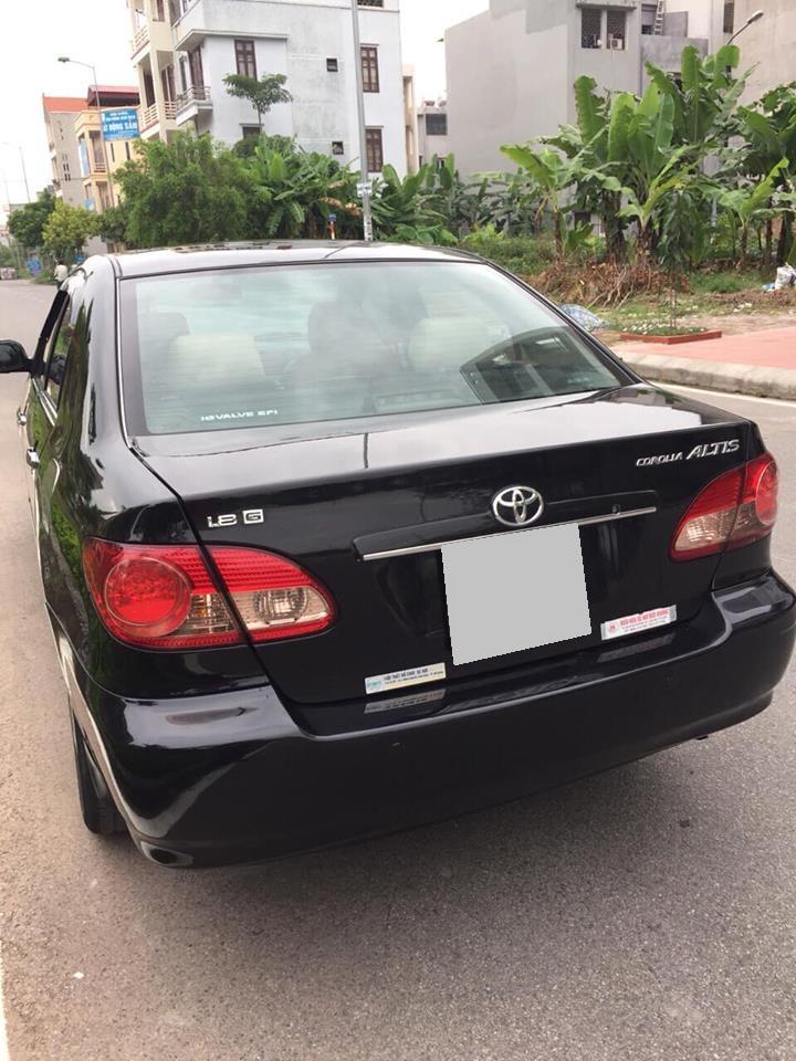 Toyota Corolla altis 2005 - Cần bán Corola Altis 2005 số sàn, màu đen xe zin cọp