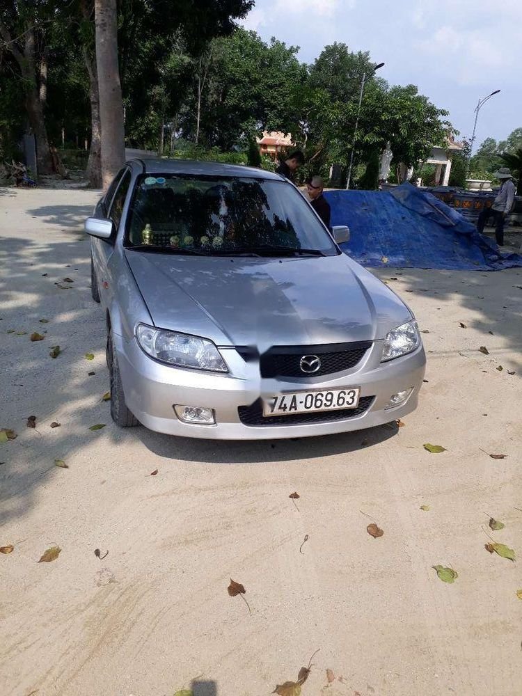 Mazda 323   2002 - Cần bán Mazda 323 sản xuất năm 2002, màu bạc, giá chỉ 149 triệu