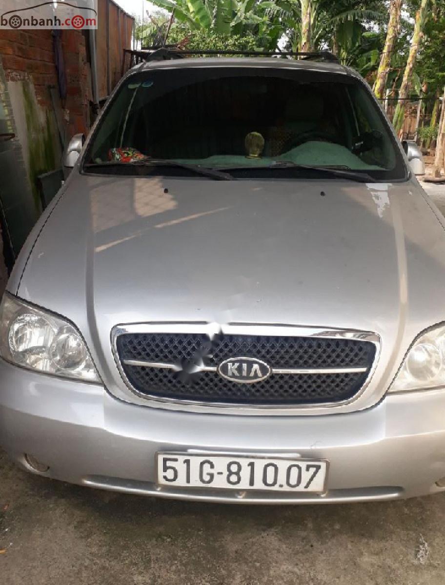 Kia Carnival GS 2.5 MT 2006 - Bán Kia Carnival GS 2.5 MT 2006, màu bạc xe gia đình