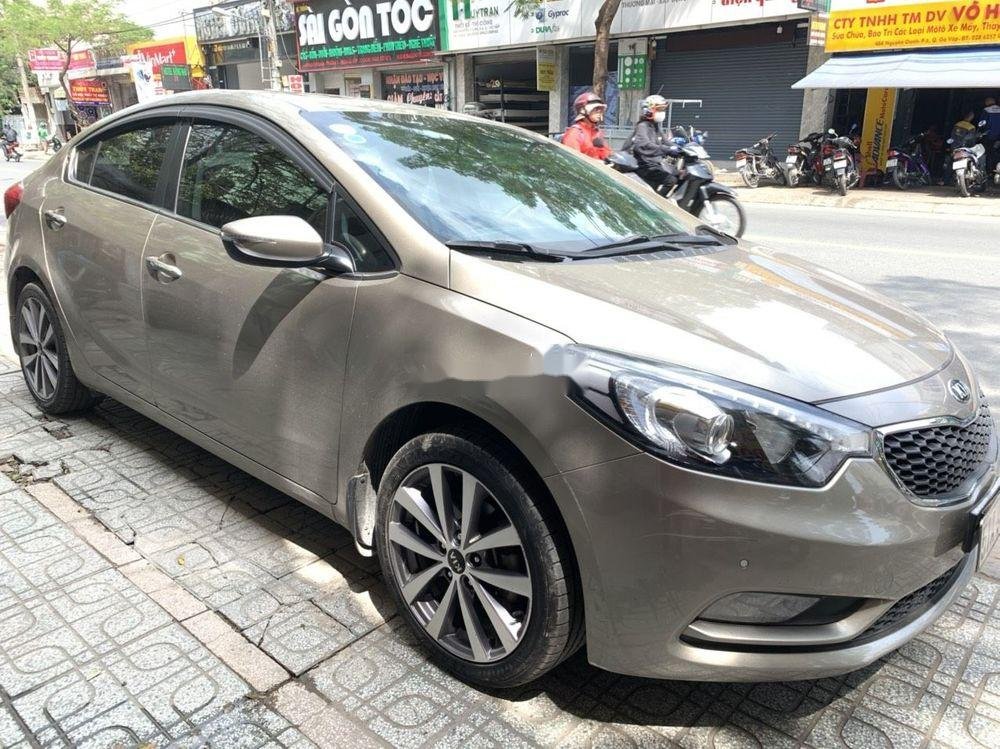 Kia K3 2014 - Bán Kia K3 sản xuất năm 2014, màu vàng số tự động, giá 482tr