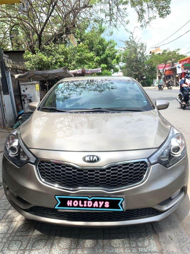 Kia K3 2014 - Cần bán xe Kia K3 năm 2014, màu vàng