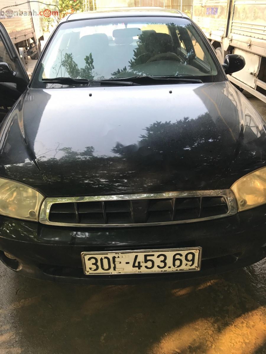 Kia Spectra 2004 - Cần bán lại xe Kia Spectra sản xuất 2004, màu đen chính chủ