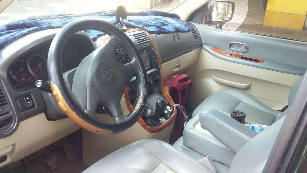 Kia Carnival 2005 - Cần bán gấp Kia Carnival đời 2006, màu đen chính chủ, 205 triệu, còn nguyên bản