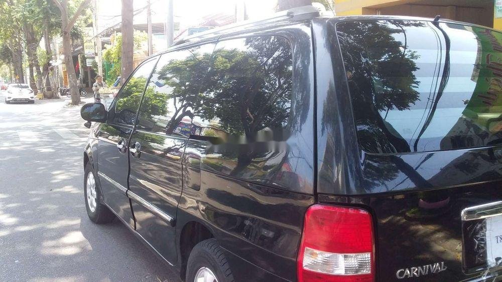 Kia Carnival 2005 - Cần bán gấp Kia Carnival đời 2006, màu đen chính chủ, 205 triệu, còn nguyên bản