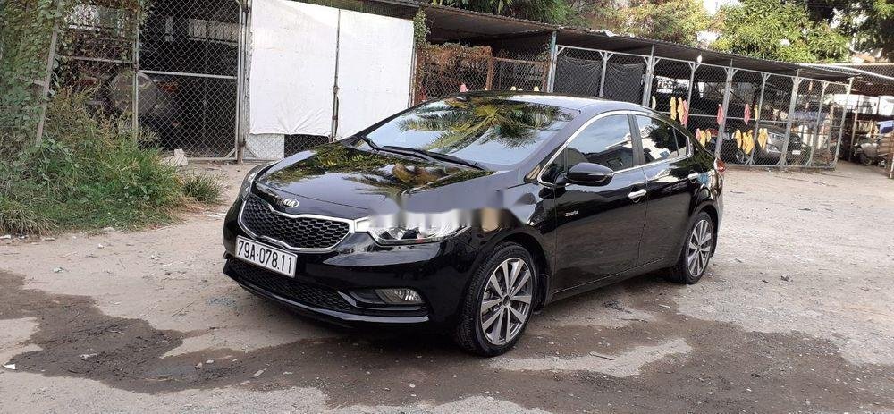 Kia K3    2014 - Cần bán Kia K3 năm sản xuất 2014, màu đen