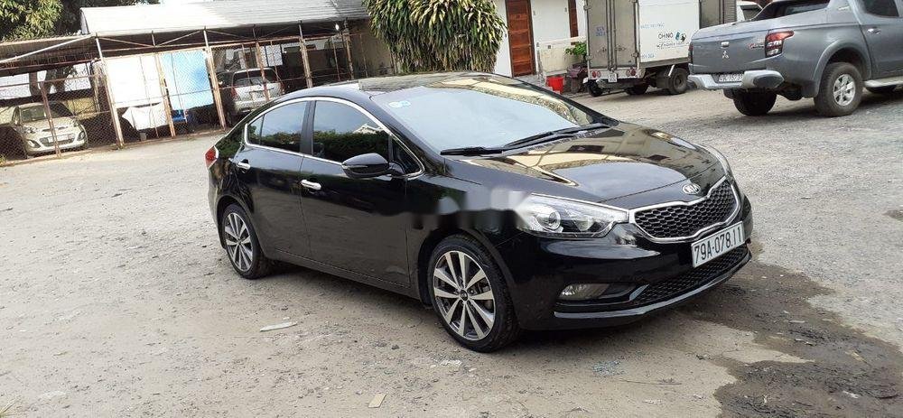 Kia K3    2014 - Cần bán Kia K3 năm sản xuất 2014, màu đen