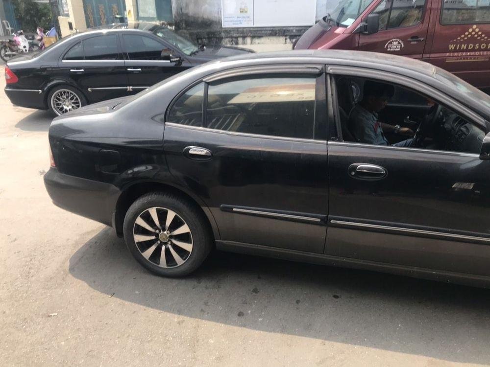 Daewoo Magnus 2004 - Bán ô tô Daewoo Magnus sản xuất 2004, màu đen, xe nhập