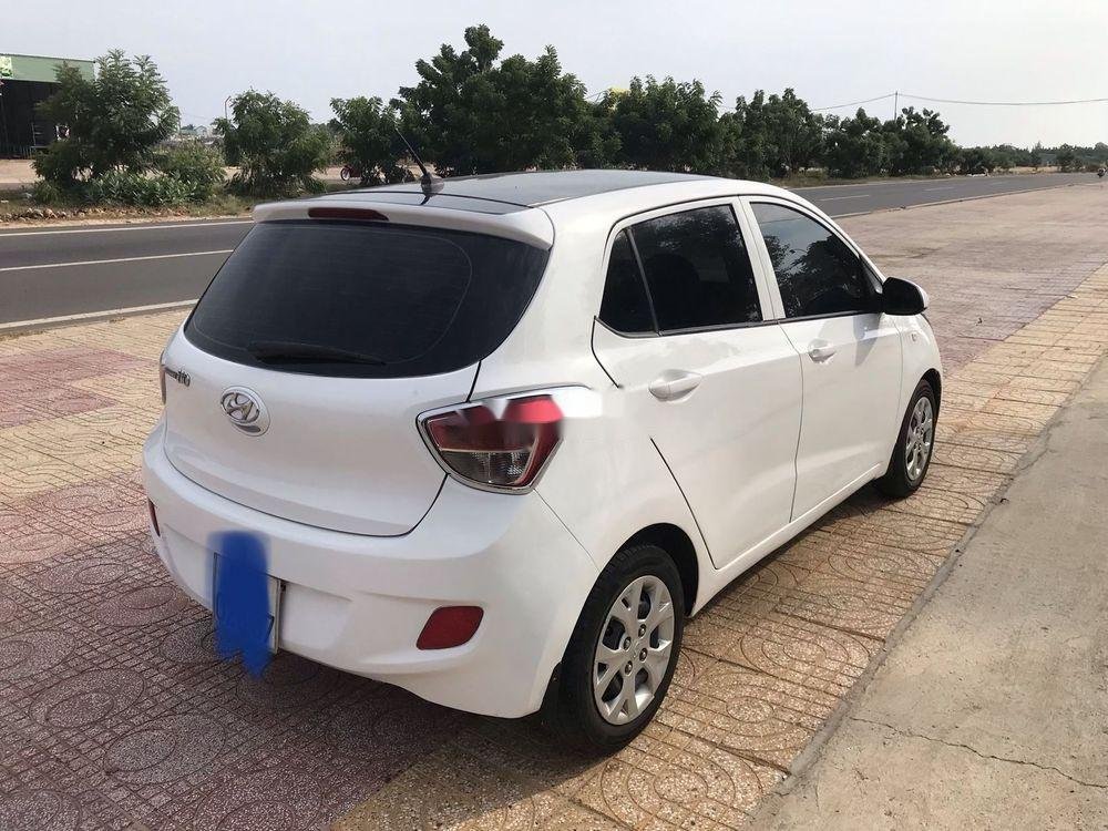 Hyundai Grand i10    MT 2014 - Cần bán Hyundai Grand i10 MT sản xuất 2014, màu trắng, nhập khẩu xe gia đình