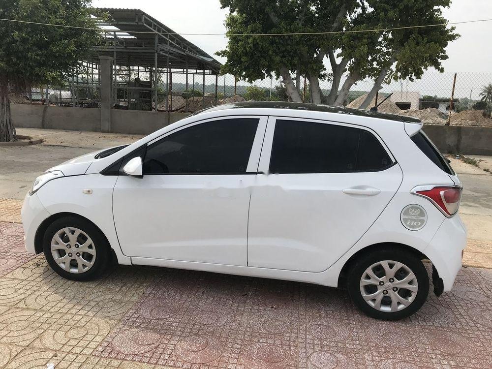 Hyundai Grand i10    MT 2014 - Cần bán Hyundai Grand i10 MT sản xuất 2014, màu trắng, nhập khẩu xe gia đình