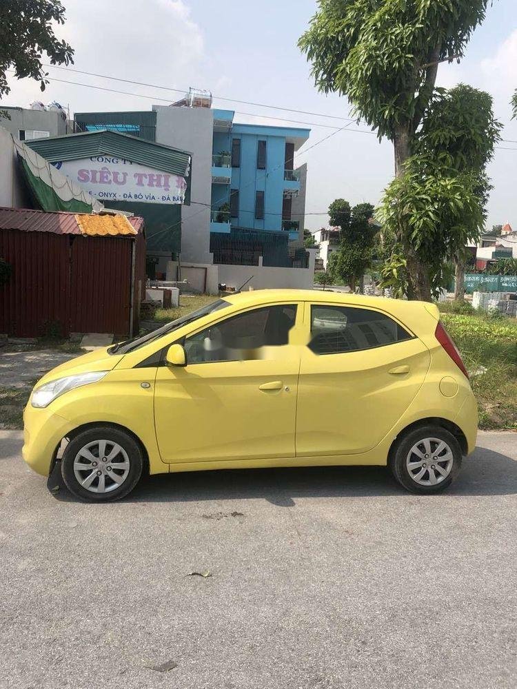 Hyundai Eon    2013 - Xe Hyundai Eon đời 2013, màu vàng, xe nhập