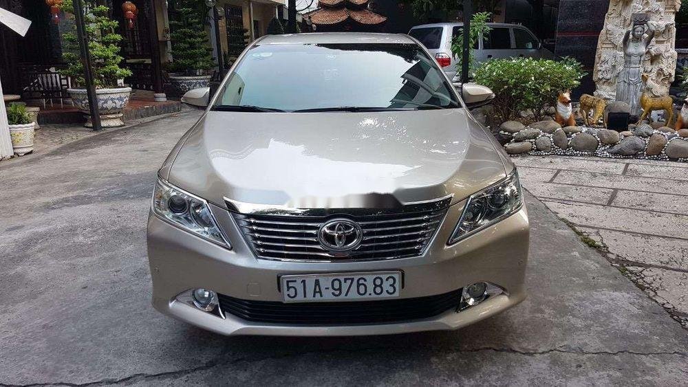 Toyota Camry   2014 - Bán Toyota Camry đời 2014, màu vàng, giá 850tr