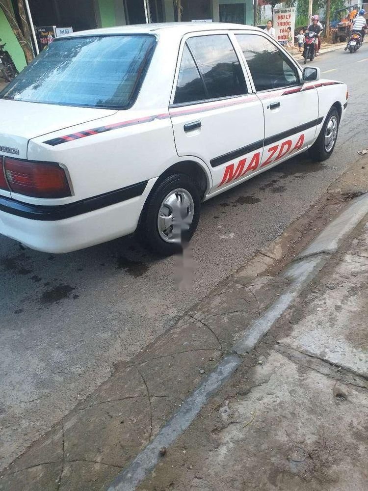 Mazda 323   1997 - Cần bán Mazda 323 sản xuất 1997, màu trắng, nhập khẩu