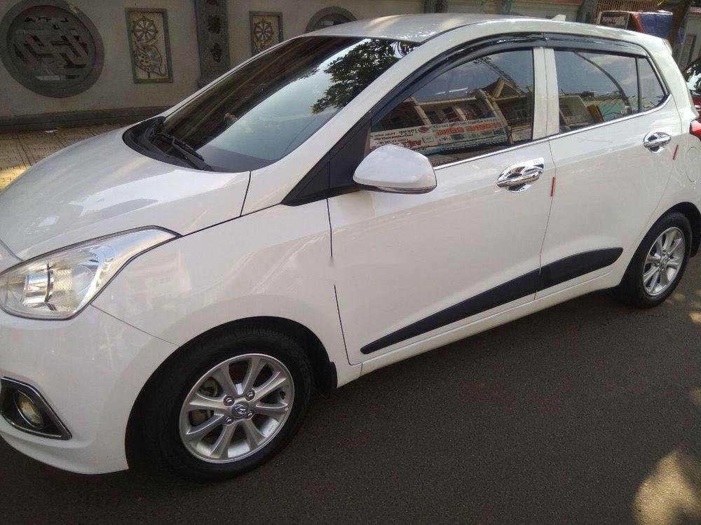 Hyundai Grand i10    AT 2016 - Cần bán gấp Hyundai Grand i10 AT sản xuất 2016, màu trắng, giá tốt