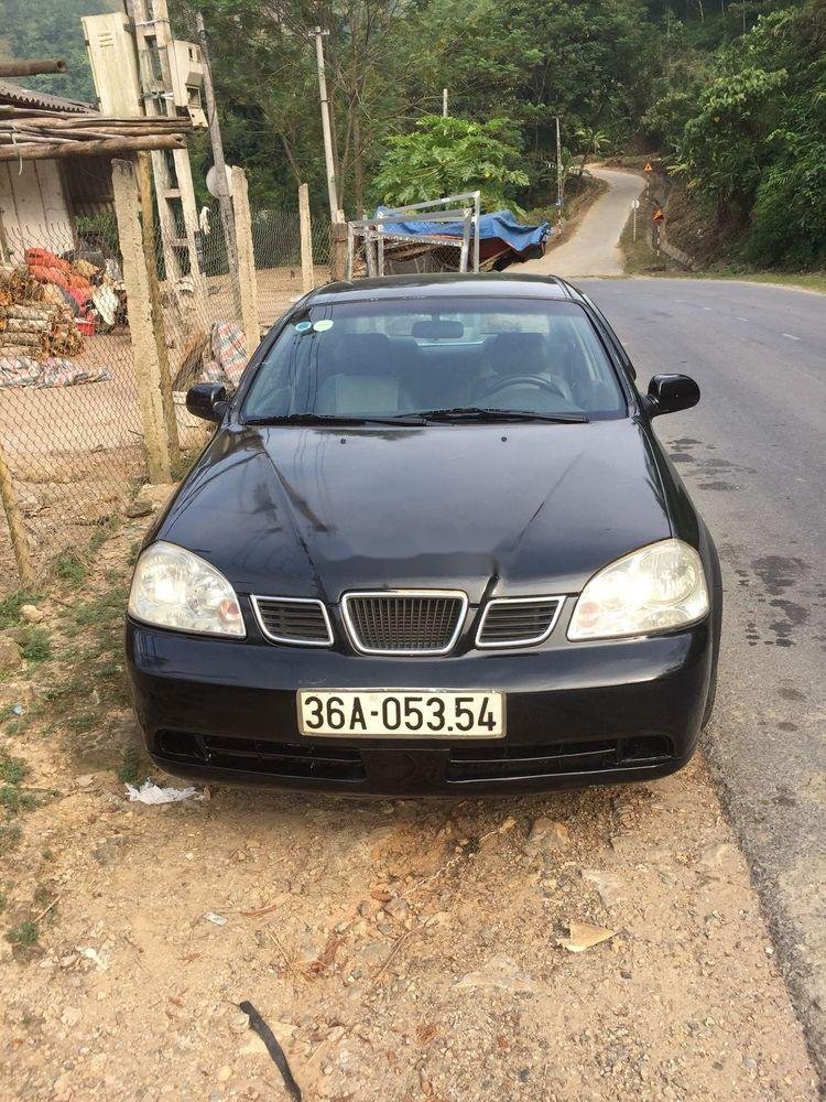 Daewoo Lacetti 2004 - Cần bán lại xe Daewoo Lacetti sản xuất năm 2004, màu đen