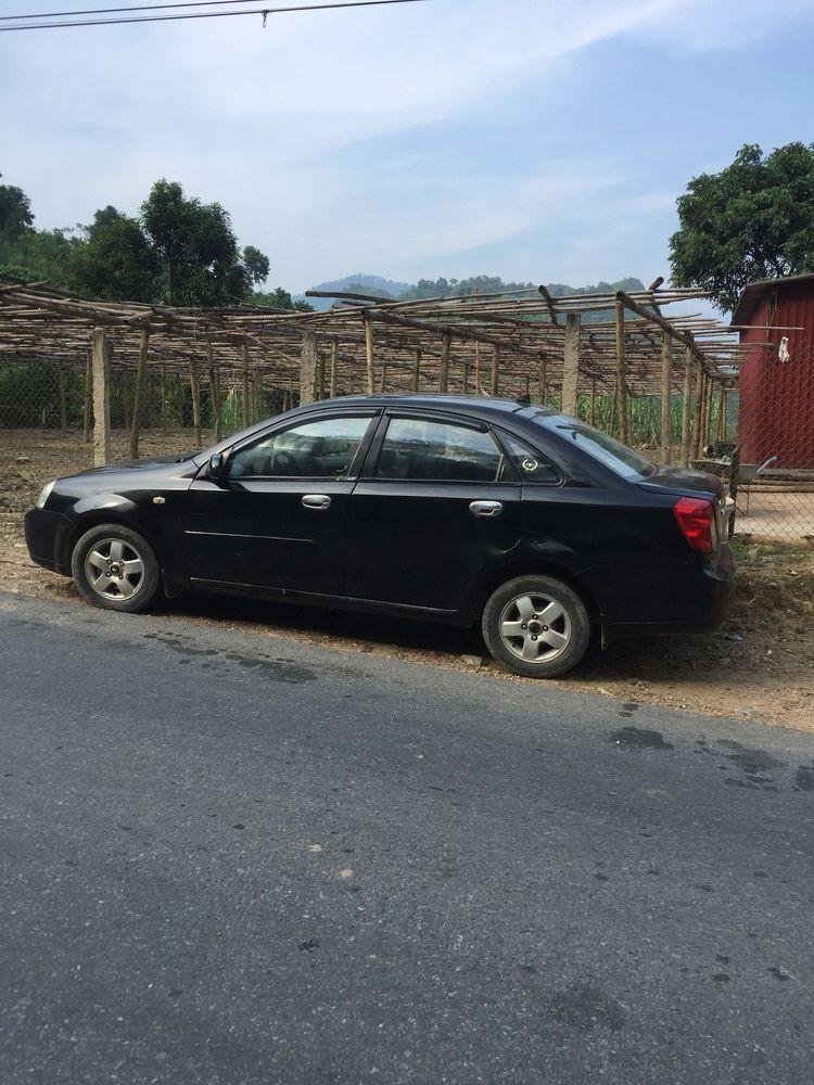 Daewoo Lacetti 2004 - Cần bán lại xe Daewoo Lacetti sản xuất năm 2004, màu đen