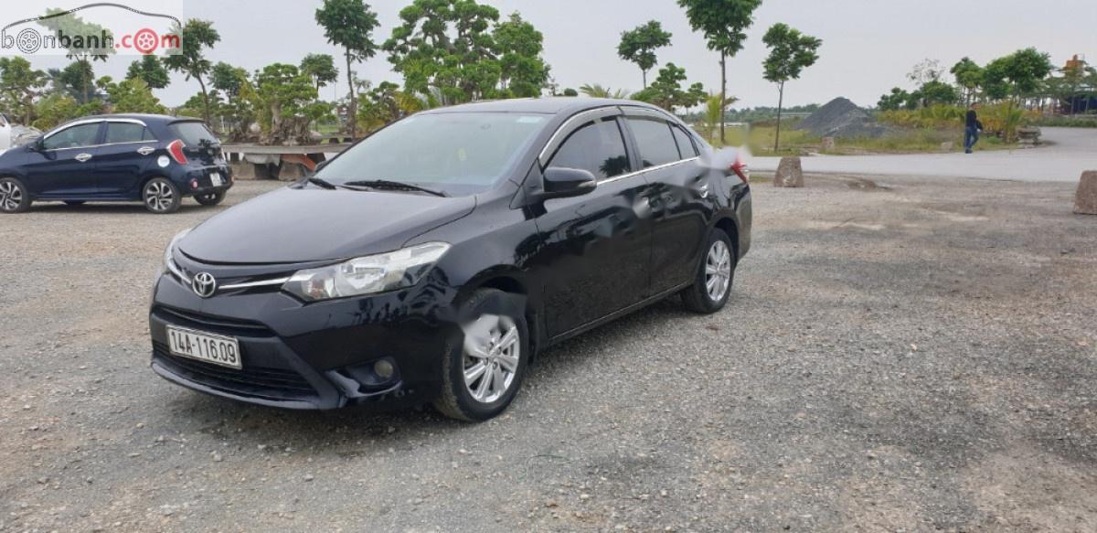 Toyota Vios 1.5E 2014 - Cần bán lại Toyota Vios E năm sản xuất 2014, màu đen, số sàn