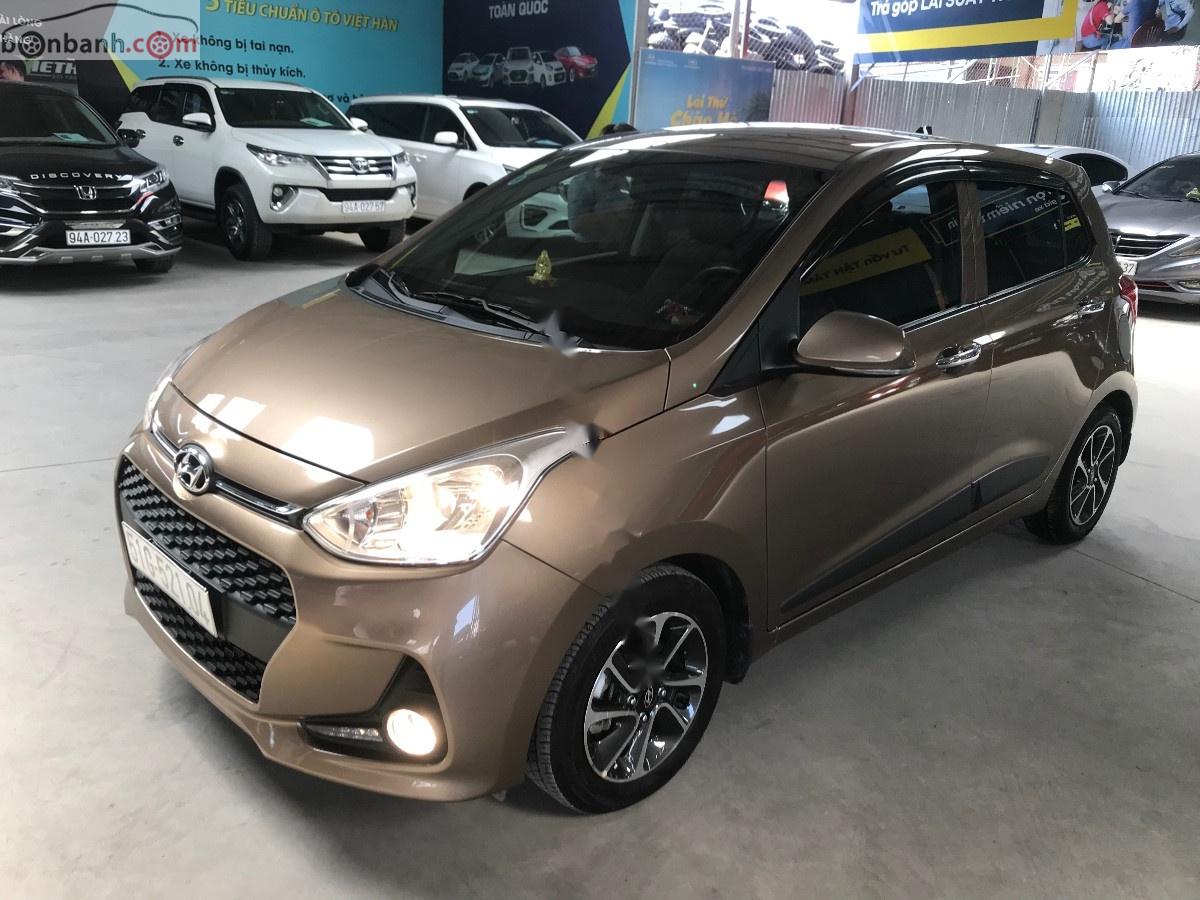 Hyundai Grand i10  1.2 AT 2017 - Bán Hyundai Grand i10 1.2AT 2017, màu nâu