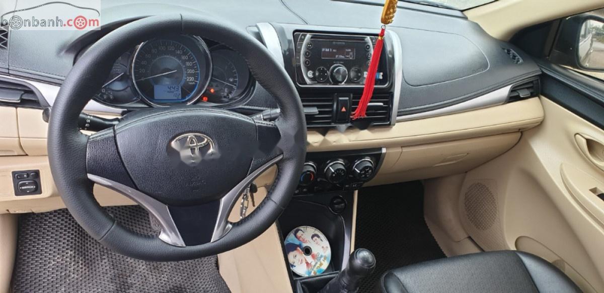 Toyota Vios 1.5E 2014 - Cần bán lại Toyota Vios E năm sản xuất 2014, màu đen, số sàn