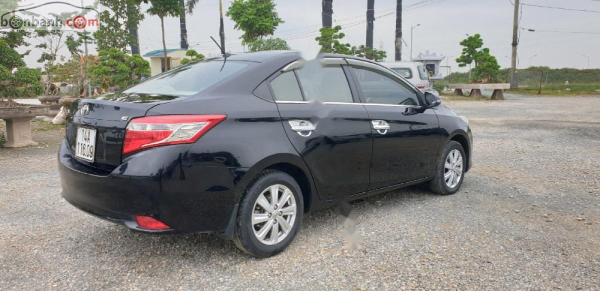 Toyota Vios 1.5E 2014 - Cần bán lại Toyota Vios E năm sản xuất 2014, màu đen, số sàn