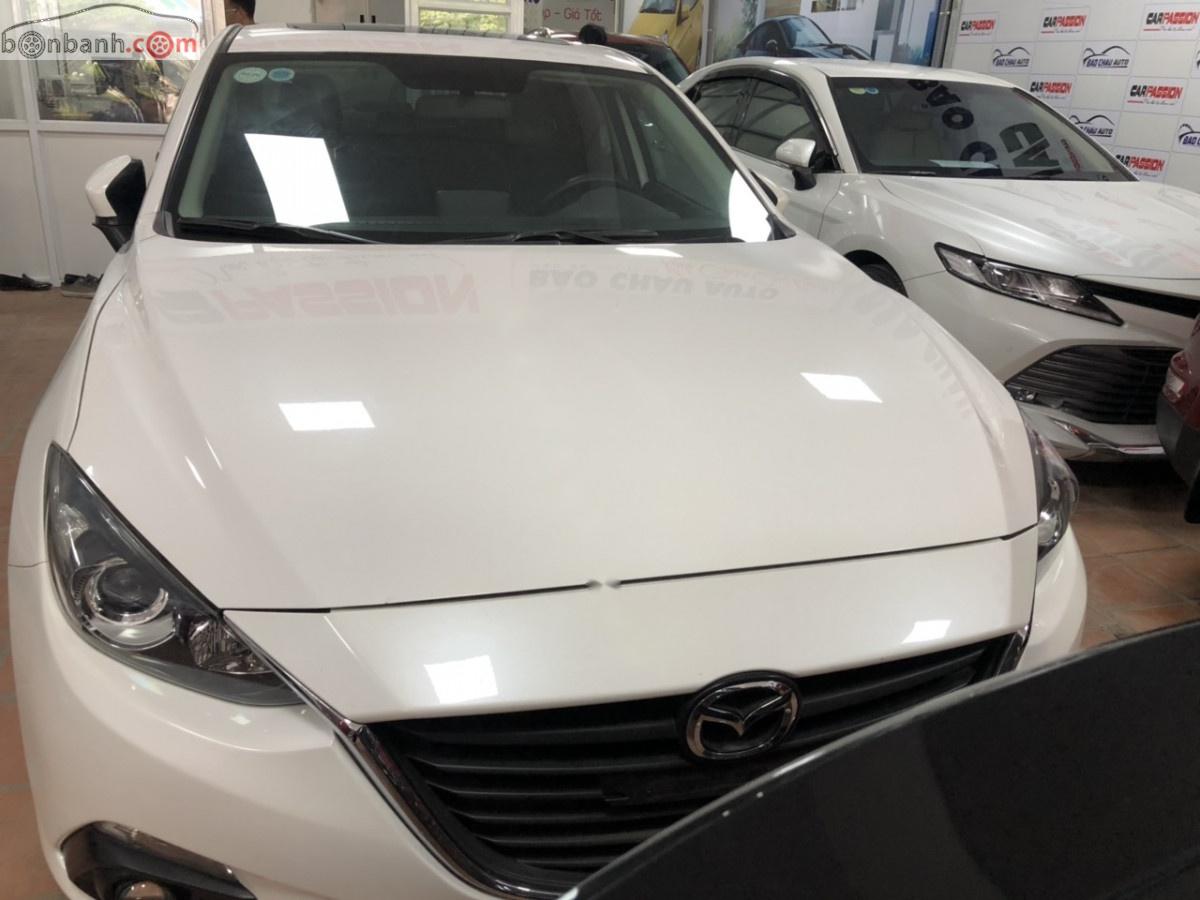 Mazda 3 2015 - Cần bán gấp Mazda 3 sản xuất năm 2015, màu trắng, 550 triệu