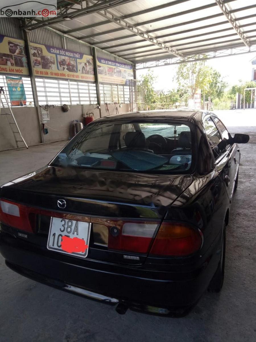 Mazda 323   2000 - Bán Mazda 323 GLXi 1.6 MT đời 2000, màu đen, xe nhập  