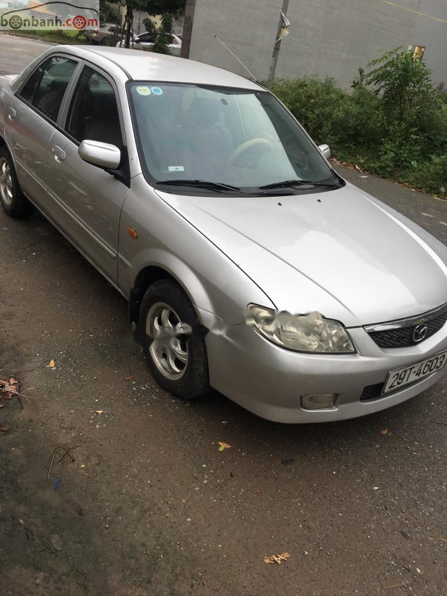 Mazda 323 2003 - Cần bán Mazda 323 MT sản xuất 2003, màu bạc chính chủ