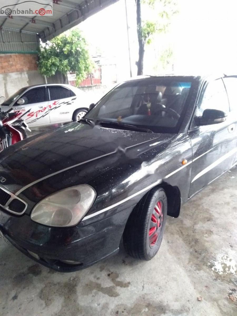 Daewoo Nubira II 1.6 2002 - Cần bán Daewoo Nubira II 1.6 năm 2002, màu đen số sàn