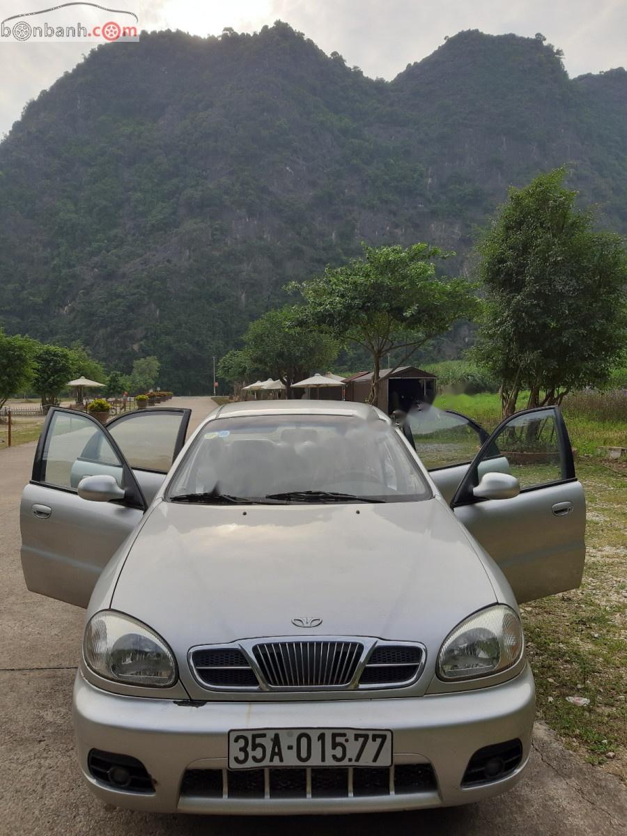 Daewoo Lanos 2005 - Cần bán lại xe Daewoo Lanos năm sản xuất 2005, màu bạc xe may chạy êm