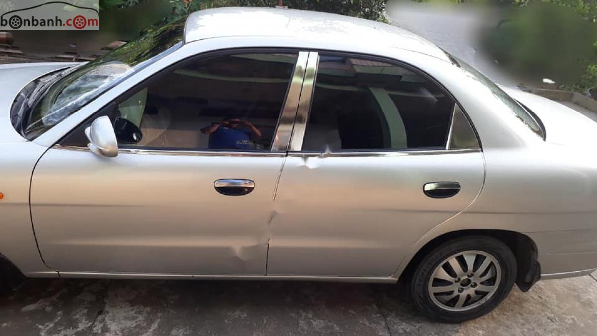 Daewoo Nubira   2004 - Cần bán Daewoo Nubira II 1.6 sản xuất 2004, màu vàng