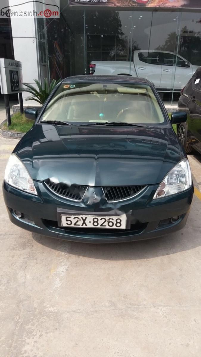 Mitsubishi Lancer 2004 - Bán Mitsubishi Lancer sản xuất năm 2004, màu xanh lam xe còn mới lắm