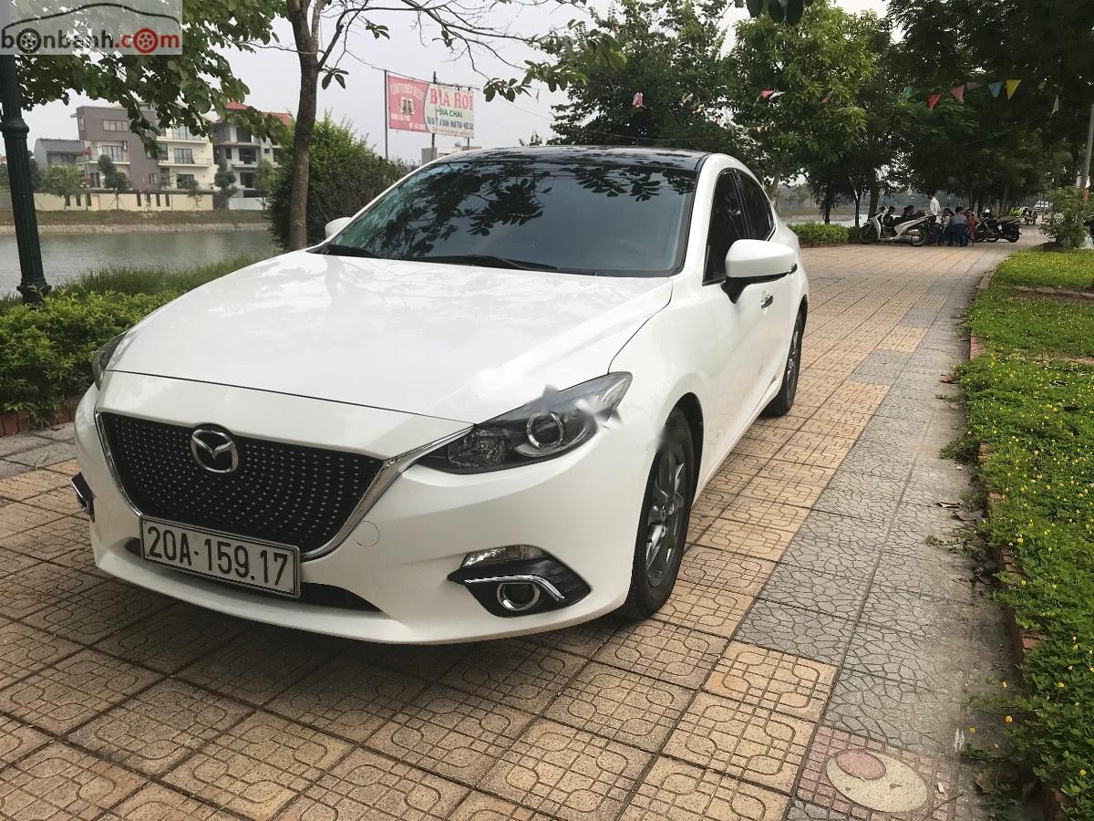 Mazda 3 2016 - Cần bán xe Mazda 3 sản xuất năm 2016, màu trắng số tự động xe còn mới lắm