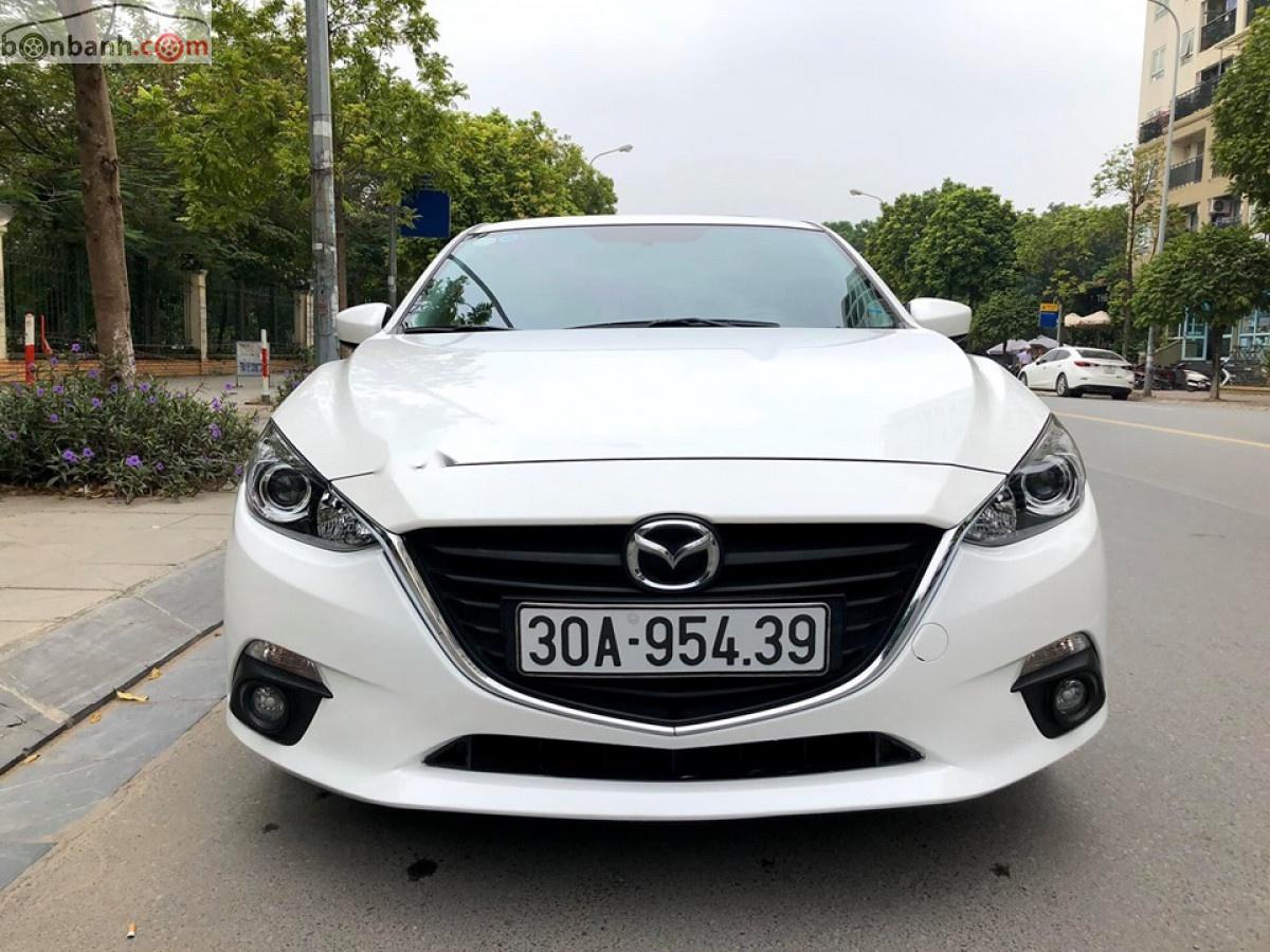 Mazda 3   2015 - Cần bán Mazda 3 sản xuất 2015, màu trắng xe còn mới nguyên