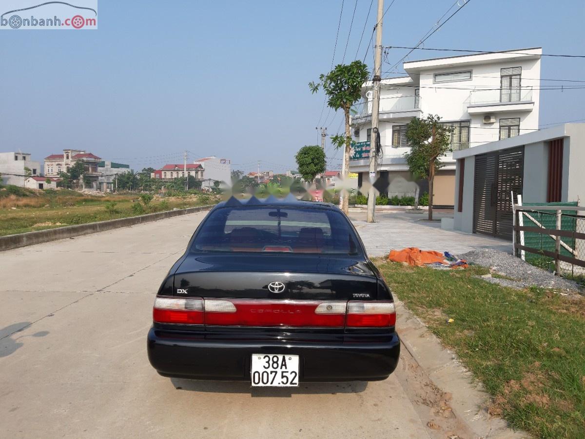 Toyota Corolla 1996 - Cần bán gấp Toyota Corolla sản xuất năm 1996, màu đen, nhập khẩu chính hãng