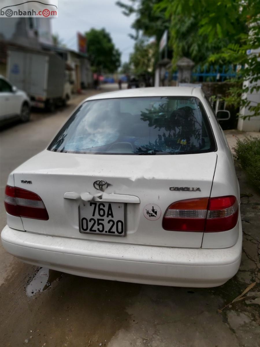 Toyota Corolla 2001 - Bán Toyota Corolla Se dan đời 2001, màu trắng, giá 99tr xe còn mới nguyên