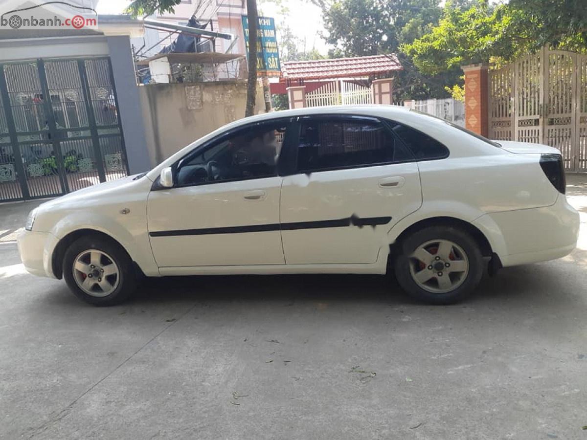 Daewoo Lacetti EX 1.6 MT 2004 - Cần bán gấp Daewoo Lacetti EX 1.6 MT năm 2004, màu trắng