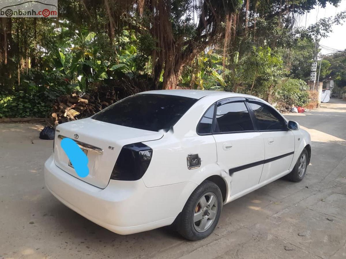 Daewoo Lacetti EX 1.6 MT 2004 - Cần bán gấp Daewoo Lacetti EX 1.6 MT năm 2004, màu trắng