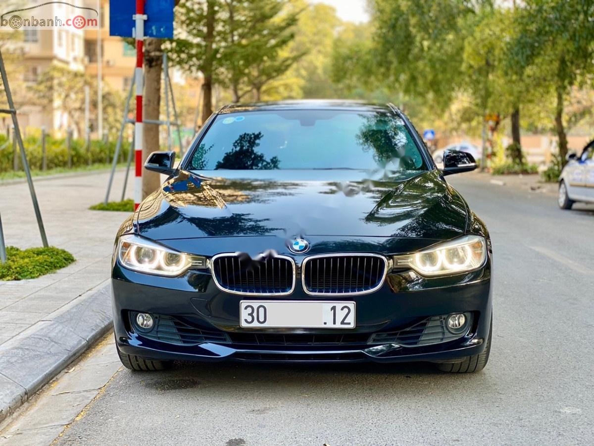 BMW 3 Series 320i 2014 - Bán xe BMW 3 Series 320i sản xuất năm 2014, màu đen, xe nhập, 850 triệu