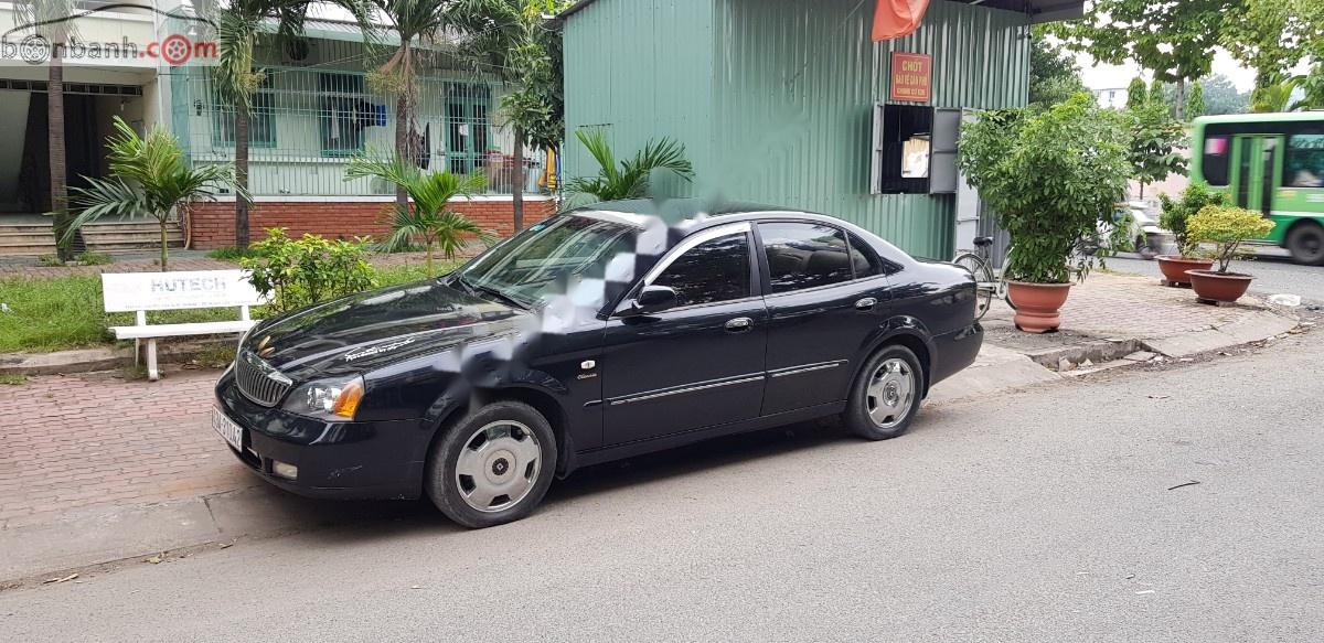 Daewoo Magnus 2.5  2004 - Cần bán gấp Daewoo Magnus 2.5 năm 2004, màu đen, nhập khẩu nguyên chiếc, giá 135tr