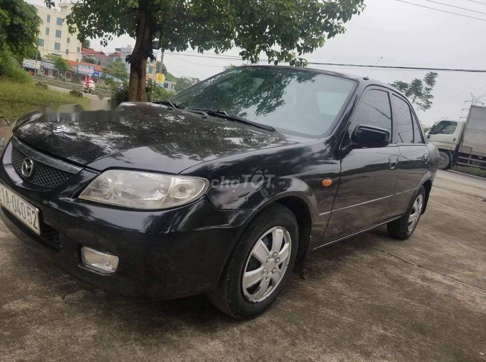 Mazda 323 2002 - Cần bán lại xe Mazda 323 đời 2001, màu đen, nhập khẩu nguyên chiếc chính chủ