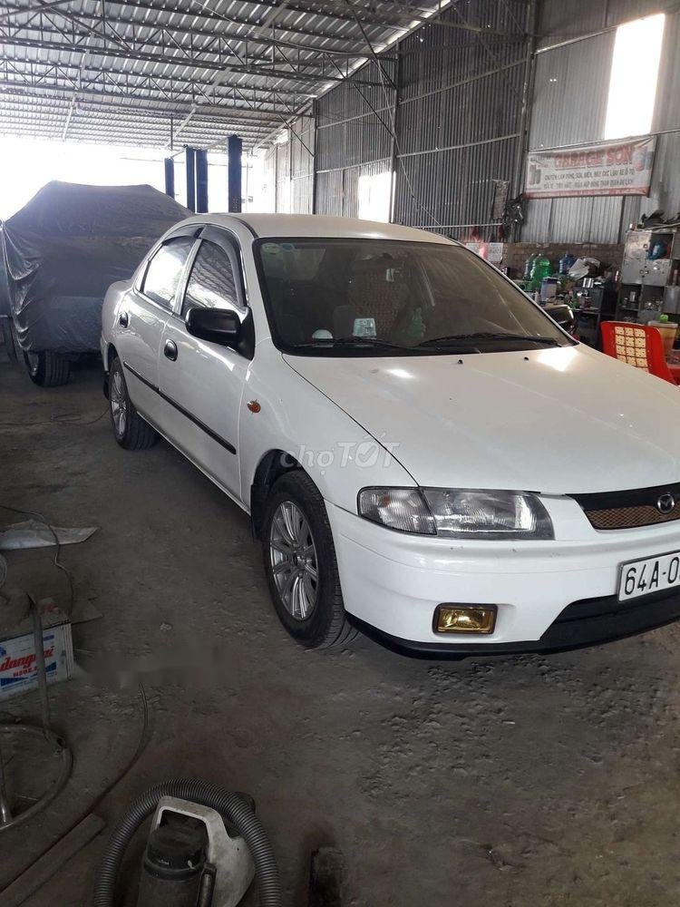 Mazda 323    1999 - Cần bán lại xe Mazda 323 sản xuất năm 1999, màu trắng giá cạnh tranh